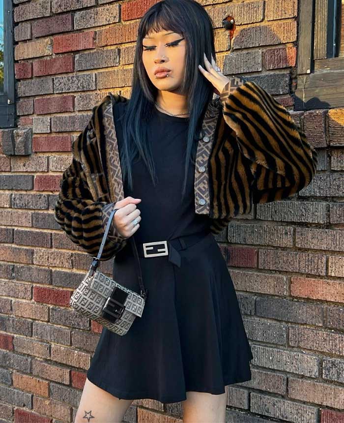 women model dressed in black fendi dress with fendi bag